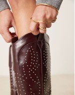 ‌Stylish studded western knee boots in burgundy